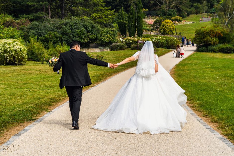 husband and wife walking together in a garden representing peace and intimacy - biblical role of a husband husband and wife walking together in a garden representing peace and intimacy - biblical role of a husband