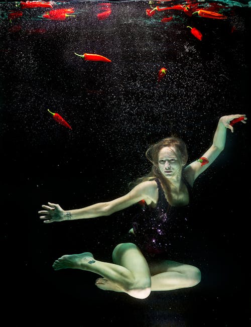 Free Woman Underwater Wearing Black One Piece Swimsuit Stock Photo