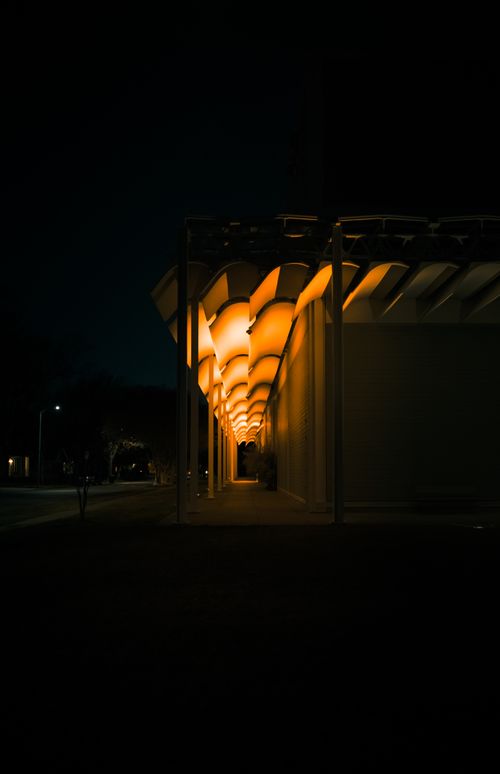 Free Captivating night view of an illuminated walkway in Houston, showcasing modern architectural design. Stock Photo