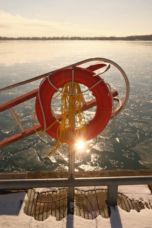 Lifebuoy on Railing at Sunset