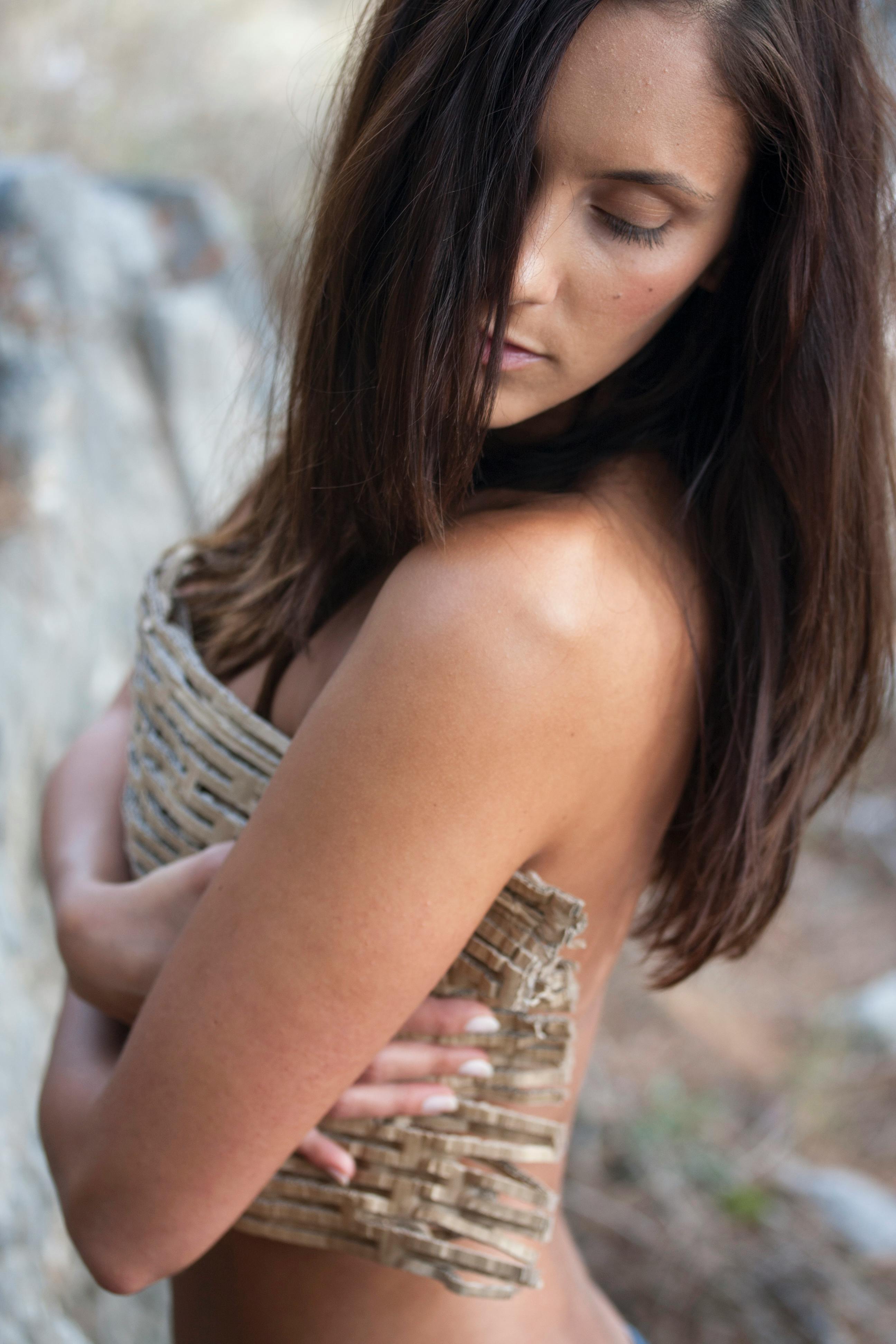 woman holding brown textile