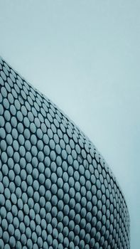 Low angle view of the modern Selfridges Building facade in Birmingham, UK with a unique pattern.