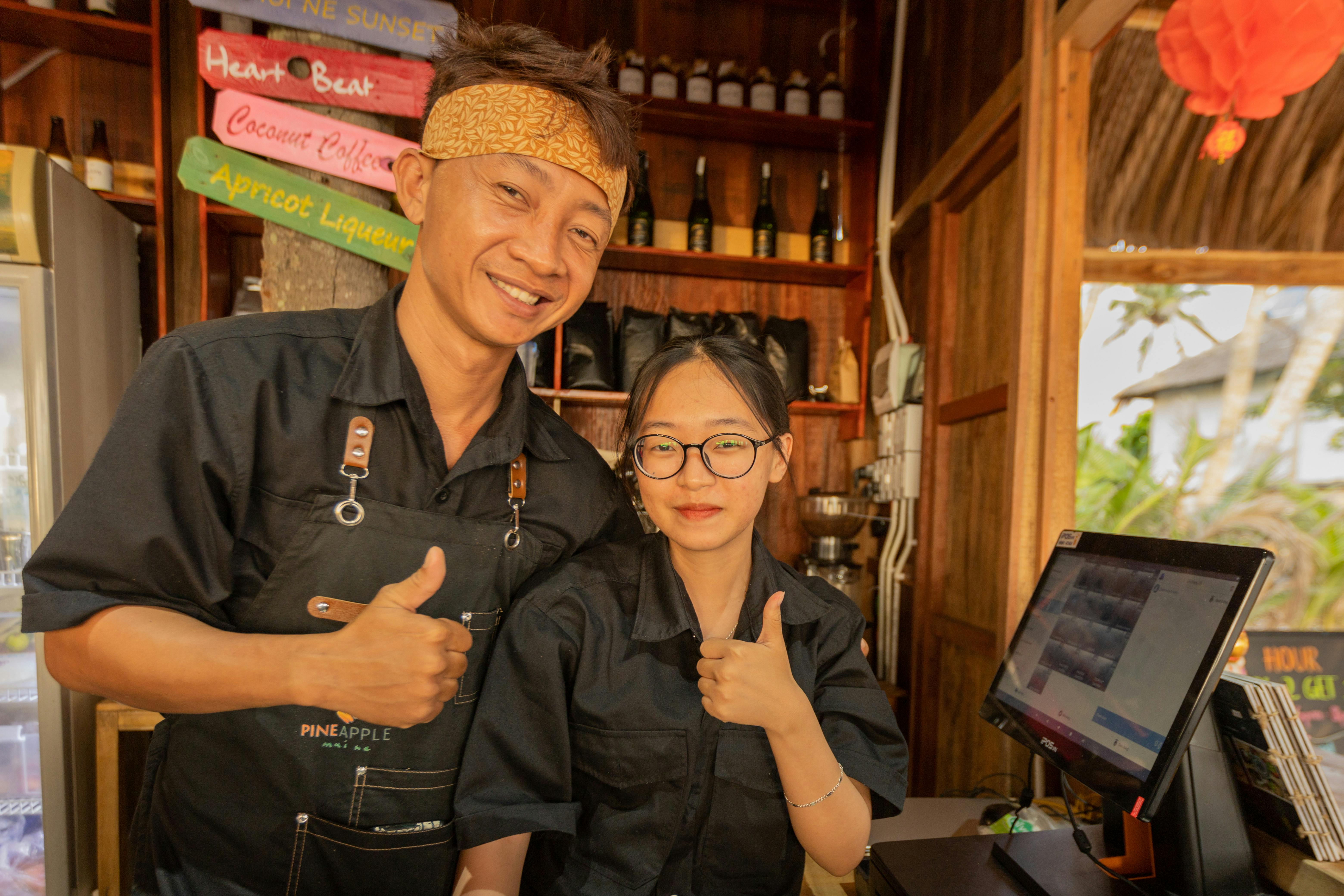 Man and woman Flashing the Thumbs Up Sign · Free Stock Photo