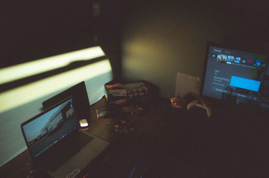 A gaming console with code on the screen