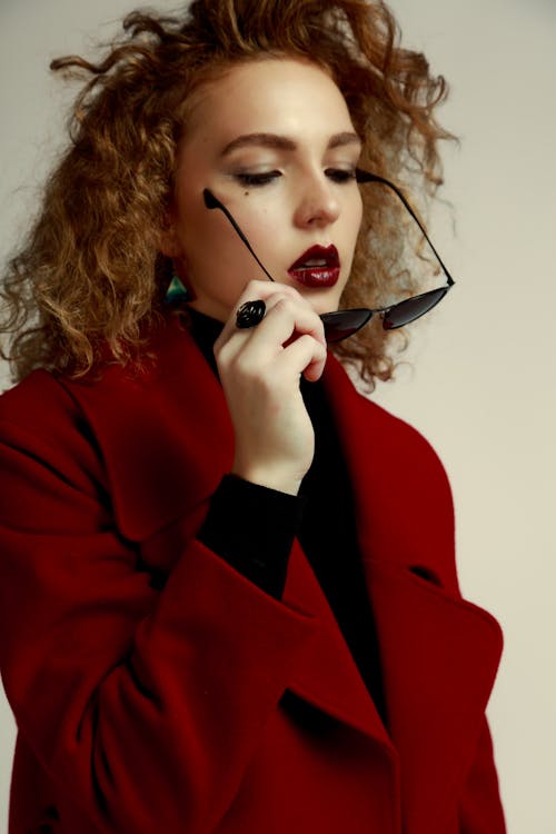 Woman with Sunglasses Posing in Studio