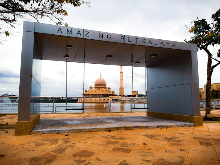 View Of Putra Mosque Surrounded By Lake In Putrajaya, Malaysia