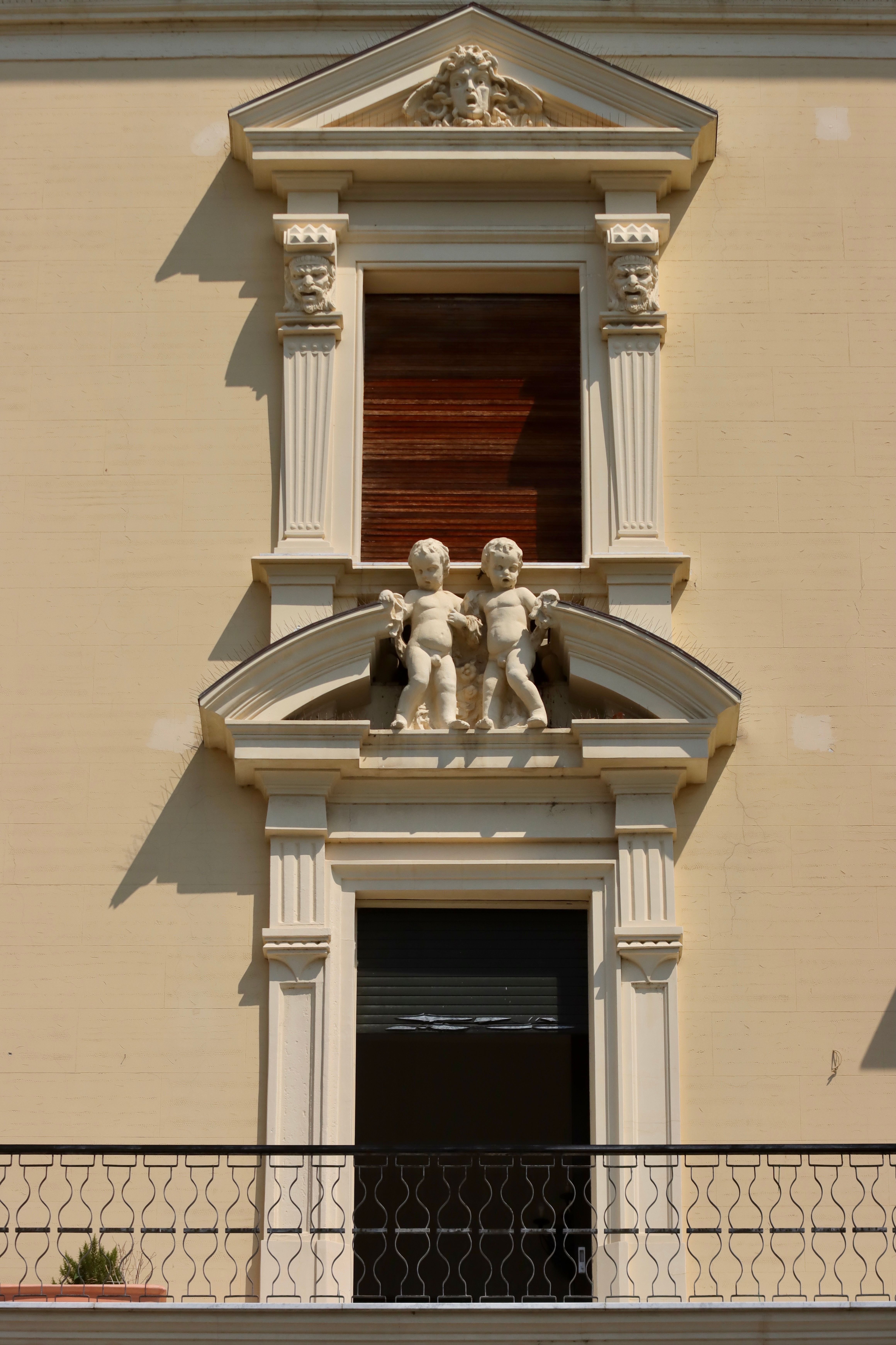 Statue of Boys above Window · Free Stock Photo