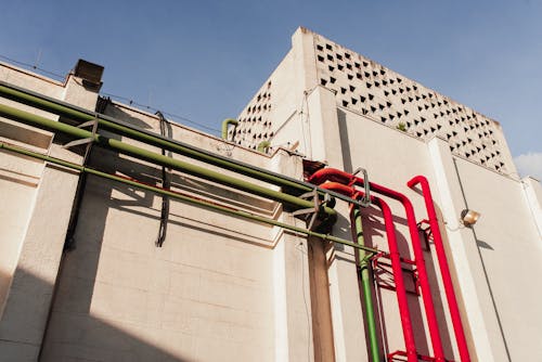 Low Angle Shot of a Building Exterior with Pipes 