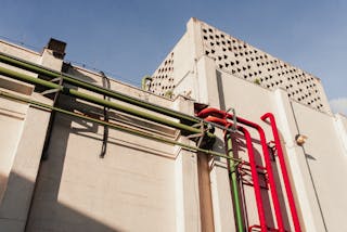 Low Angle Shot of a Building Exterior with Pipes 