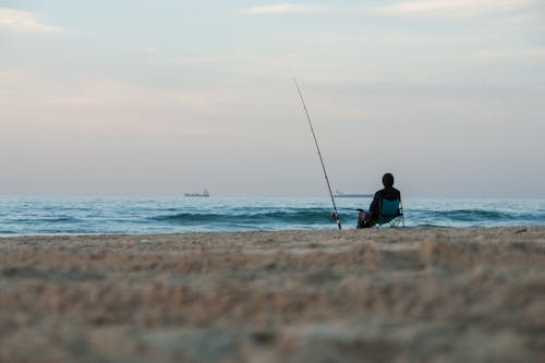 Man Fishing on the Shore 