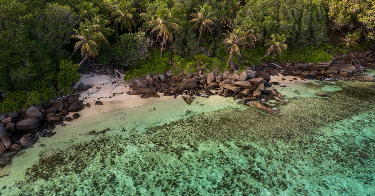 Seychelles Coral Reefs And Luxury Resorts With Granite Boulders And Turquoise Waters