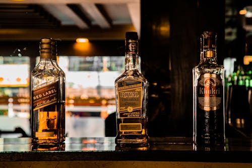 Bottles of Whiskey on a Bar Counter 