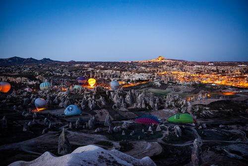 Free Stunning view of illuminated hot air balloons over Cappadocia's unique landscape at twilight. Stock Photo