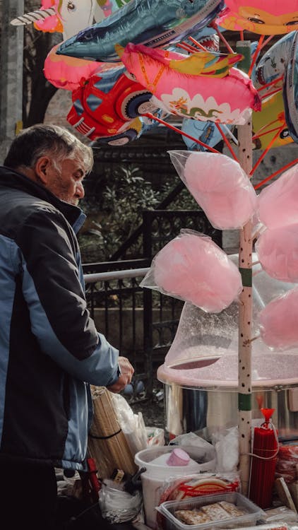 Man Working on Cotton Candy Stand