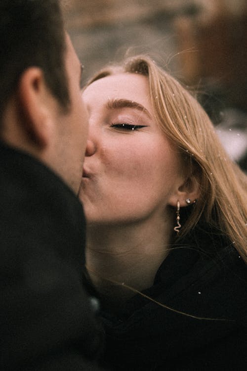 Woman Kissing Man
