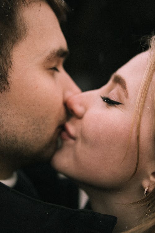 Woman Kissing Boyfriends Cheek