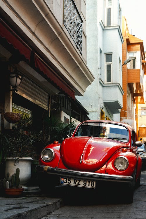 Red Old-fashioned Car on Street