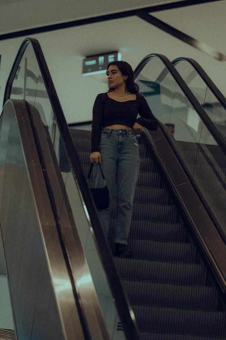 A Woman On An Escalator 