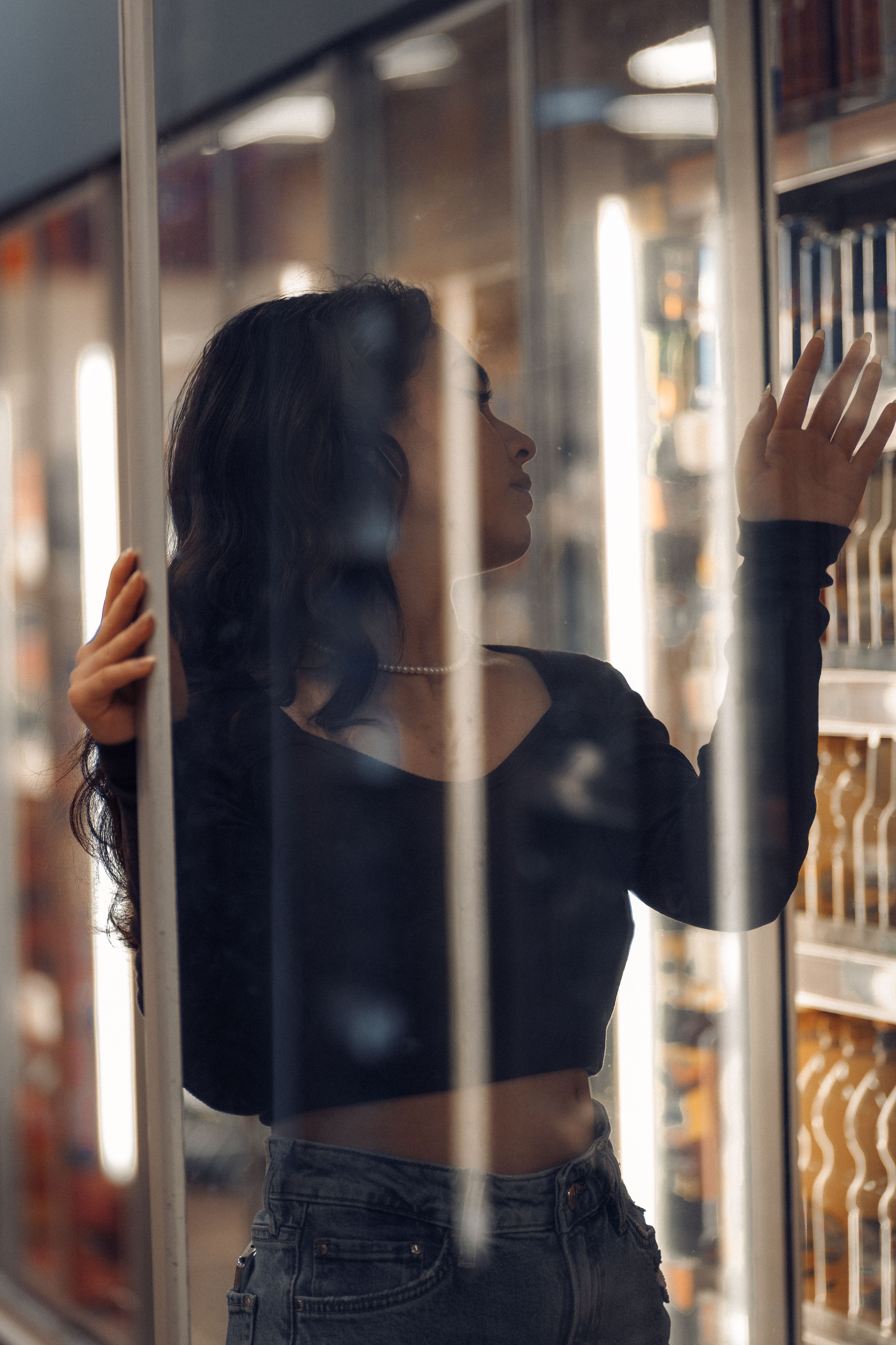 Woman Posing behind Store Window · Free Stock Photo