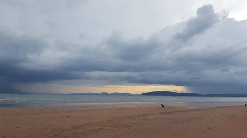 Free Stunning seascape at Ao Nang Beach, Thailand, with dramatic clouds and a calm shore. Stock Photo