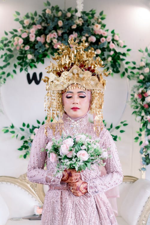 Woman Posing in Traditional Dress and with Golden Crown