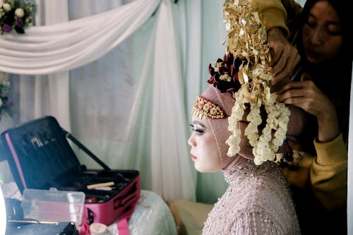 Preparing Woman Wreath for Ceremony