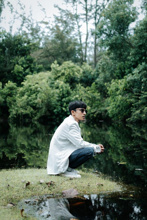 Man in Shirt Posing by Pond