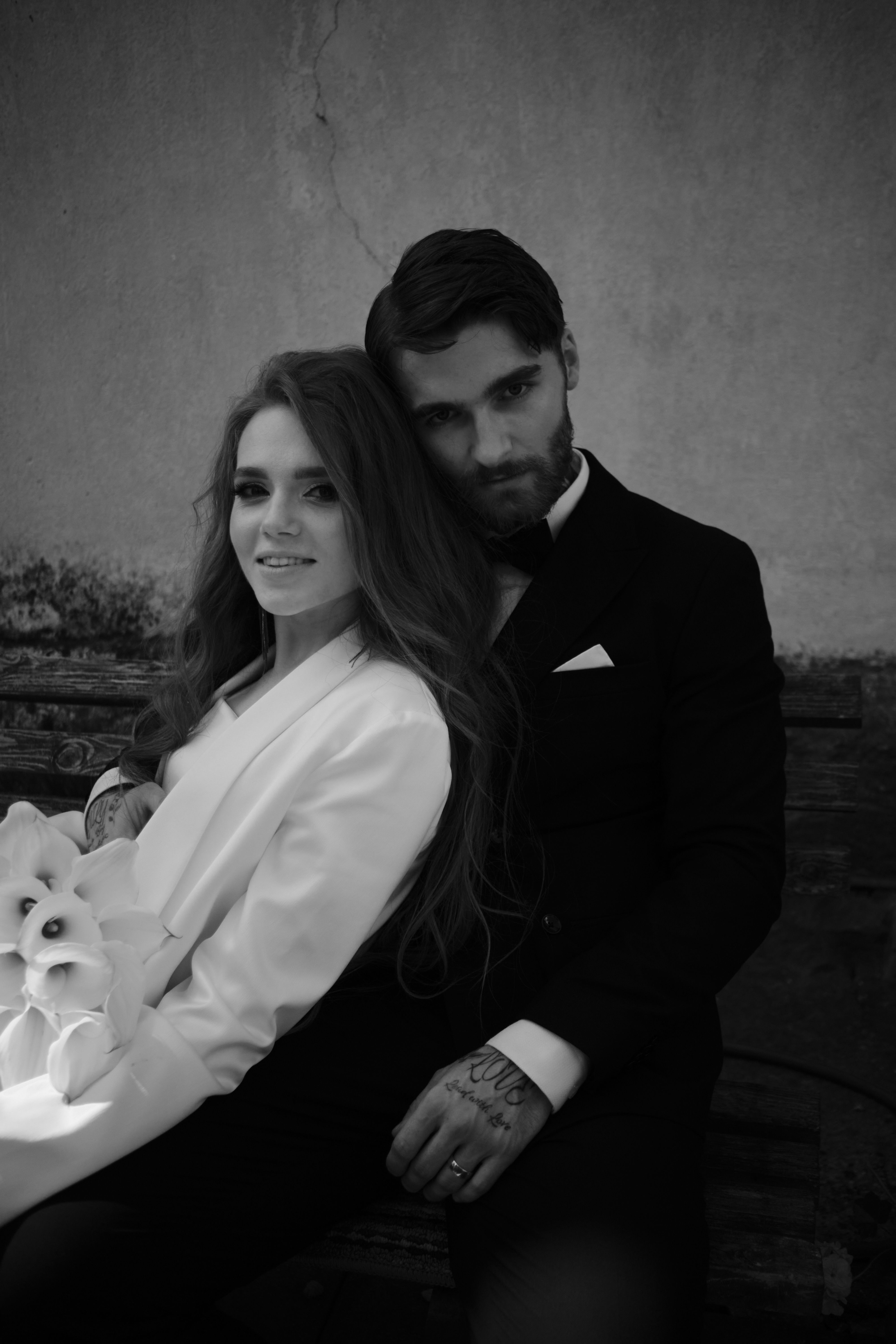 Man in Suit Posing with Woman in Black and White · Free Stock Photo