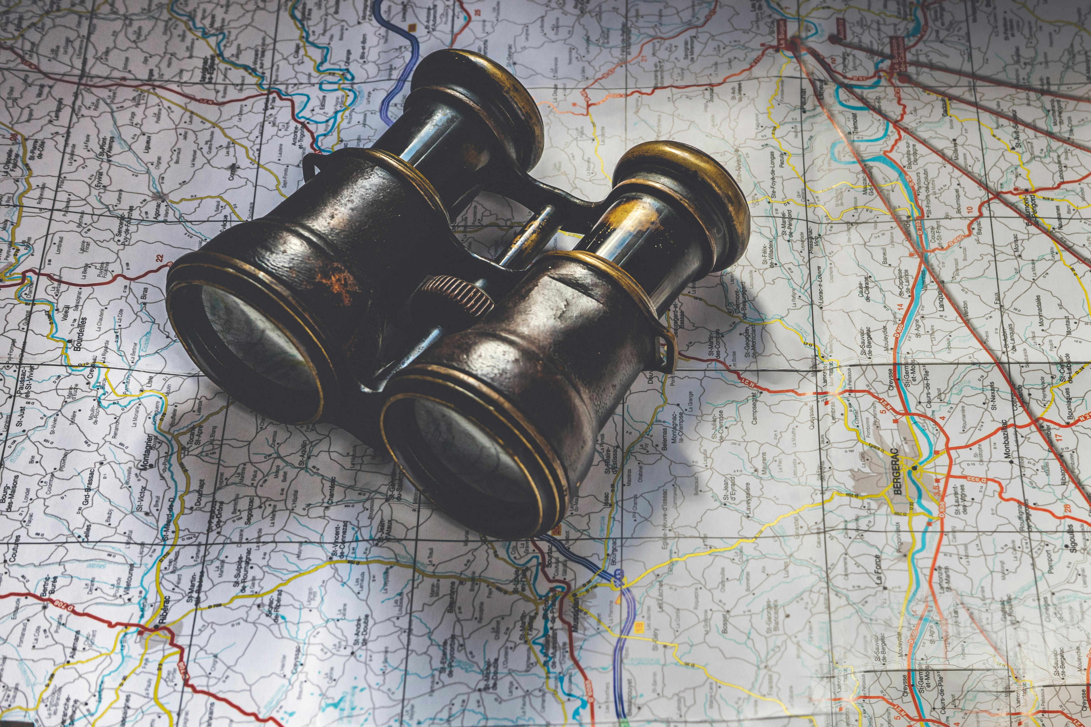 Vintage Binocular on Top of a Map