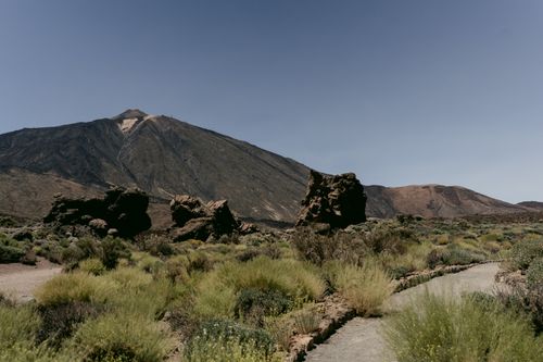 Free Discover the magnificent Mount Teide with its unique volcanic landscape under a clear blue sky. Stock Photo