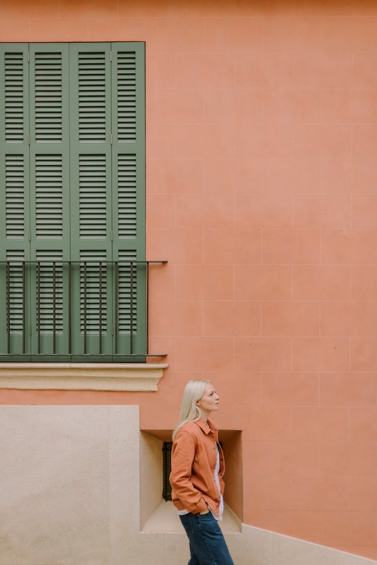 Woman Near Building Wall