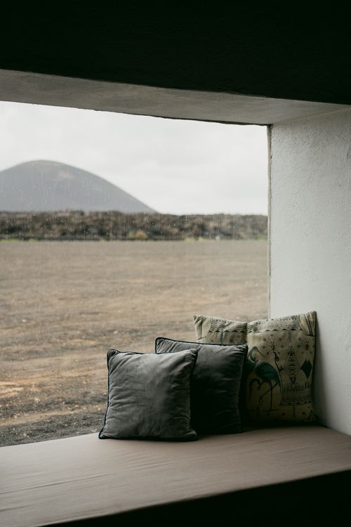 Window seat with cushions overlooking the landscape