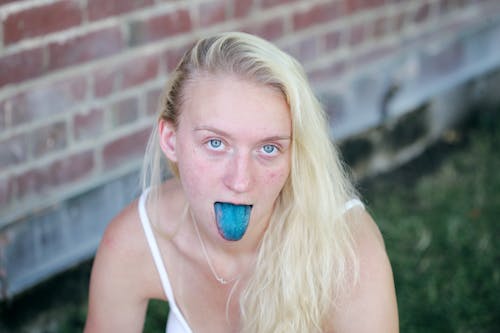 Woman Showing Blue Tongue