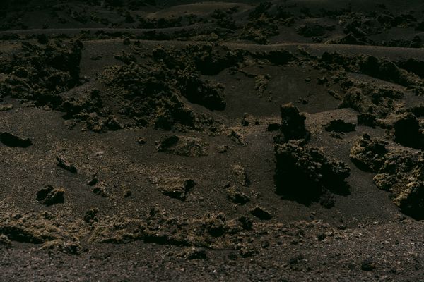 Cover art for Siege of the Empire of Ash — dark volcanic terrain. Photo by alleksana on Pexels