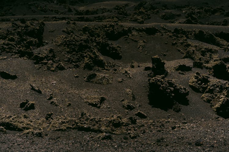 Rocks And Sand In Volcanic Soil