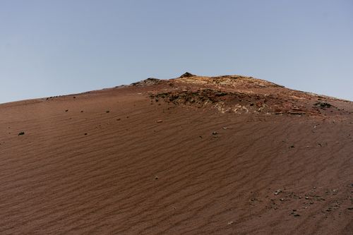 Free Expansive desert scene showcasing sand dunes under a clear blue sky. Stock Photo
