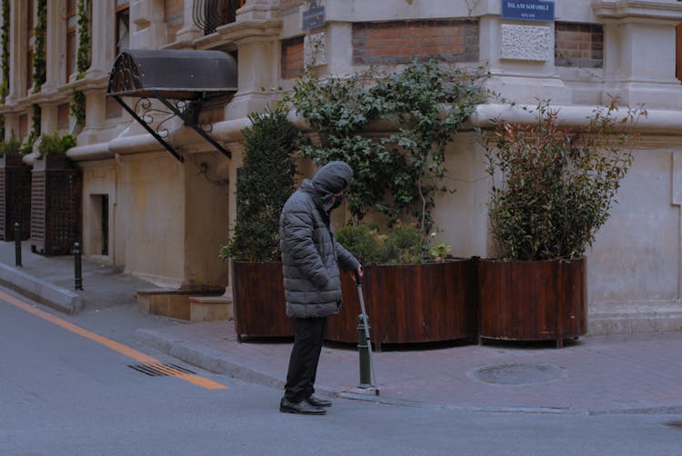 Old Man With Cane On City Street