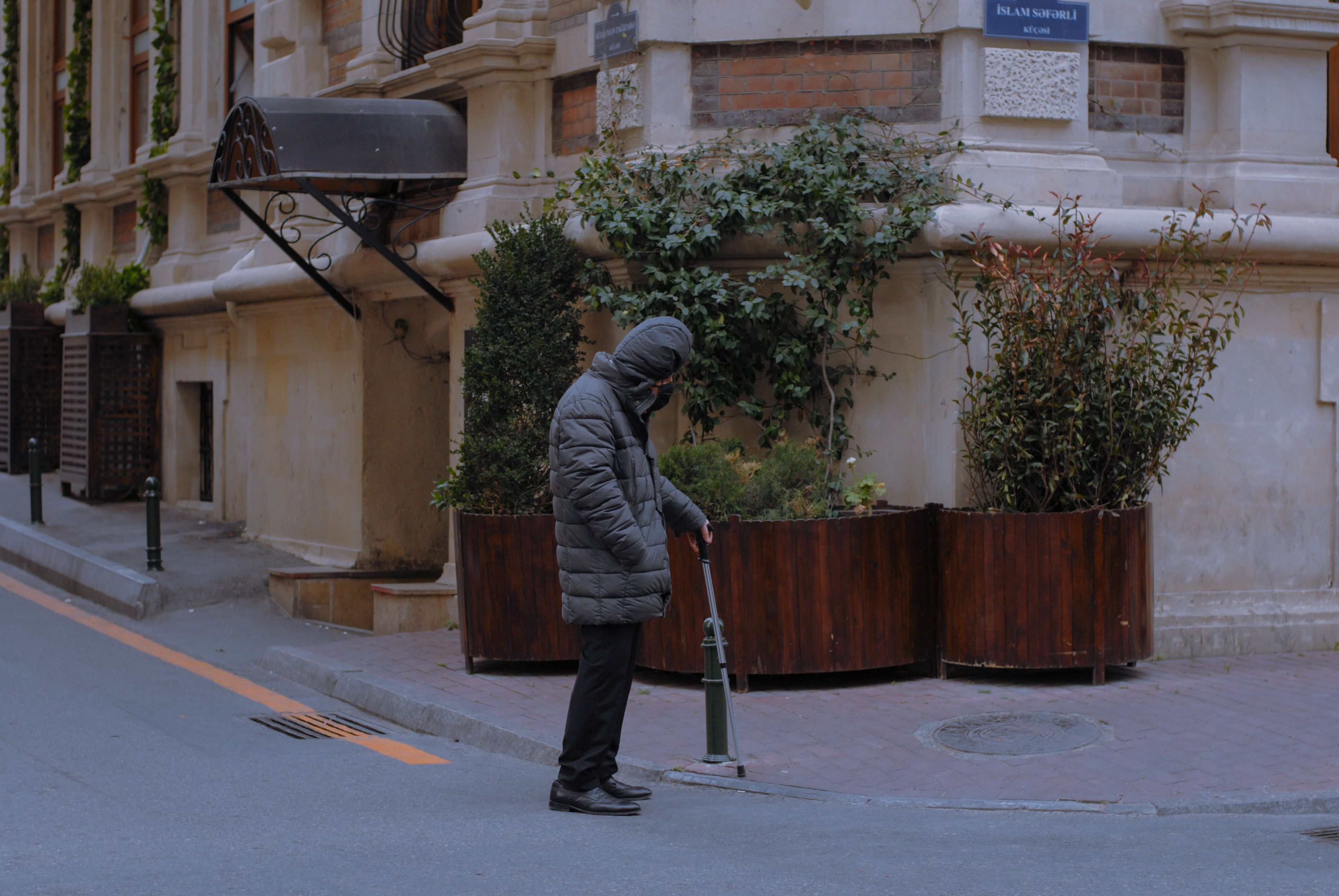 Old Man with Cane on City Street · Free Stock Photo