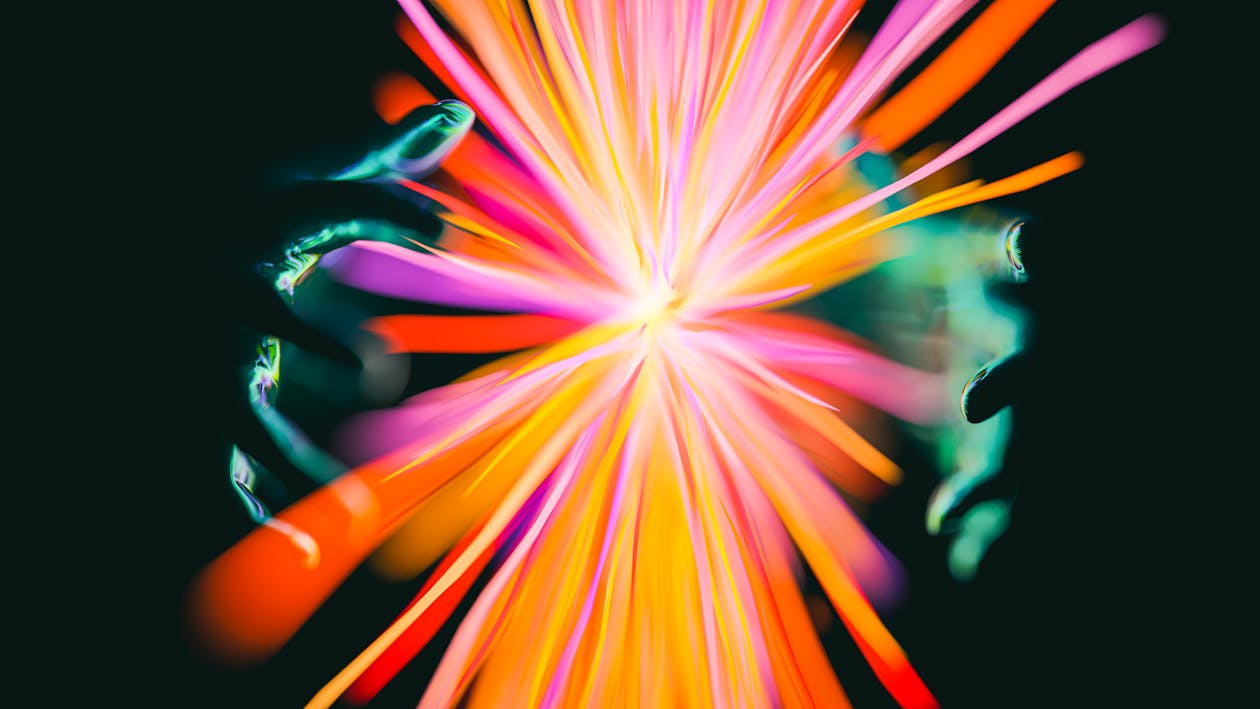 A colorful abstract image of a person with their arms out