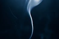 Smoke on a dark background with a blue background