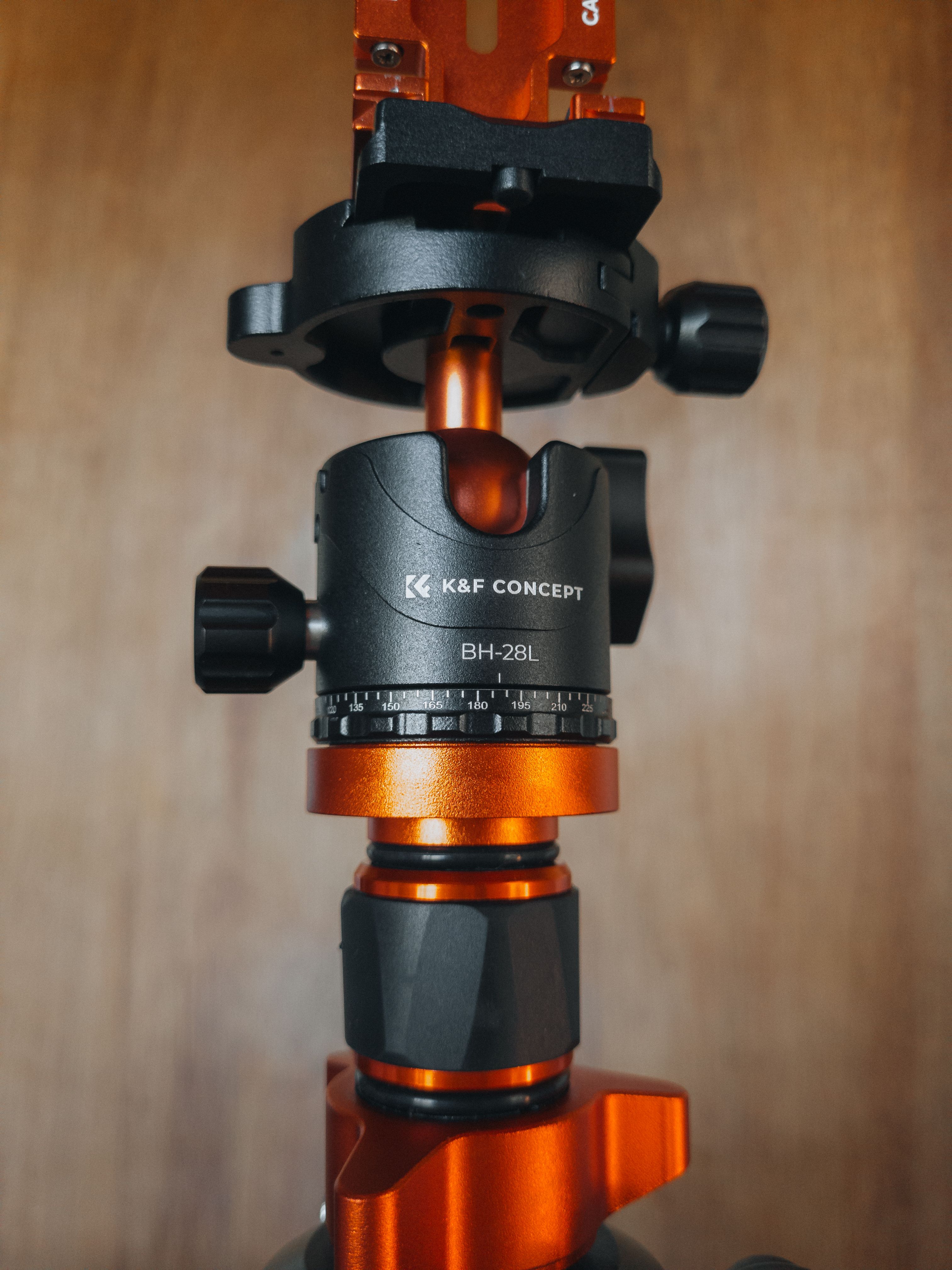 Detailed look at a K&F Concept BH-28L ball head with orange accents for precision photography.