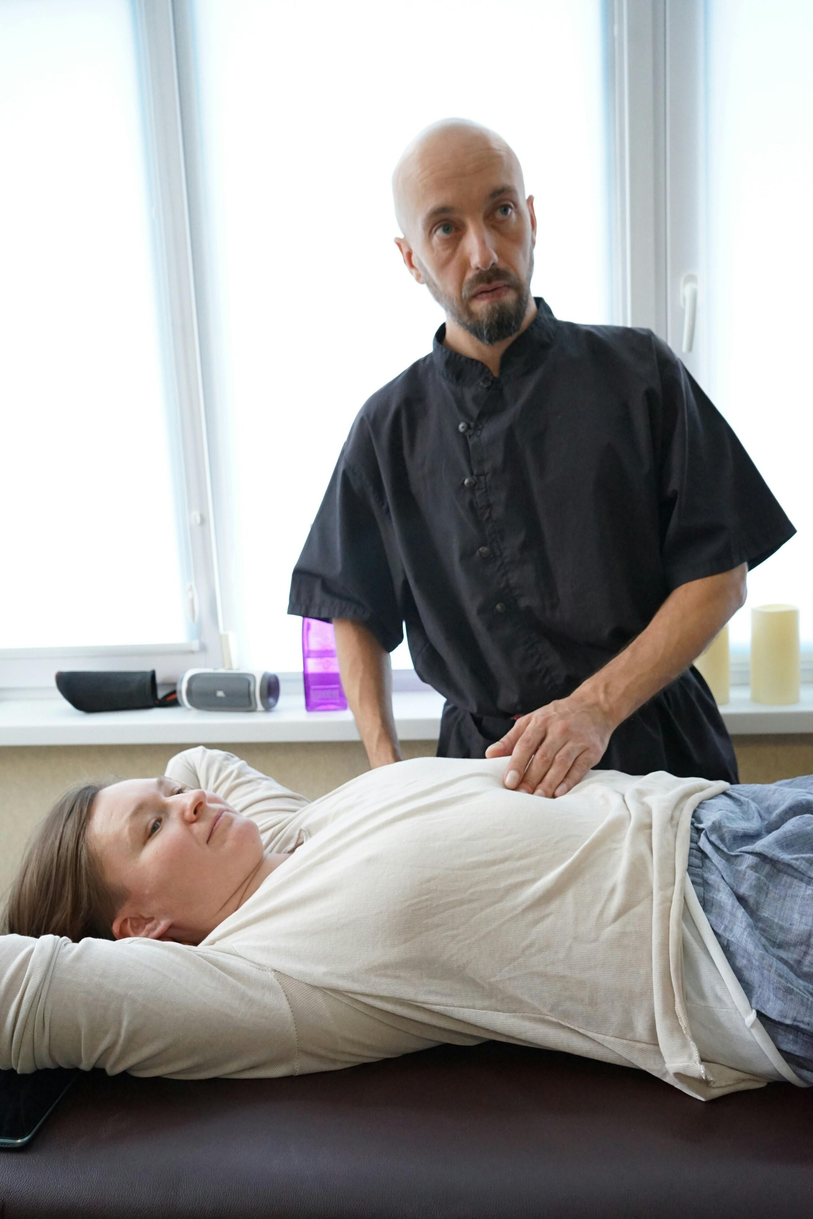 Woman Lying on a Massage Table and Getting a Massage · Free Stock Photo