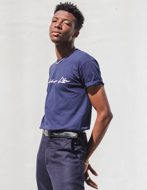 Young Man Posing on White Studio Background