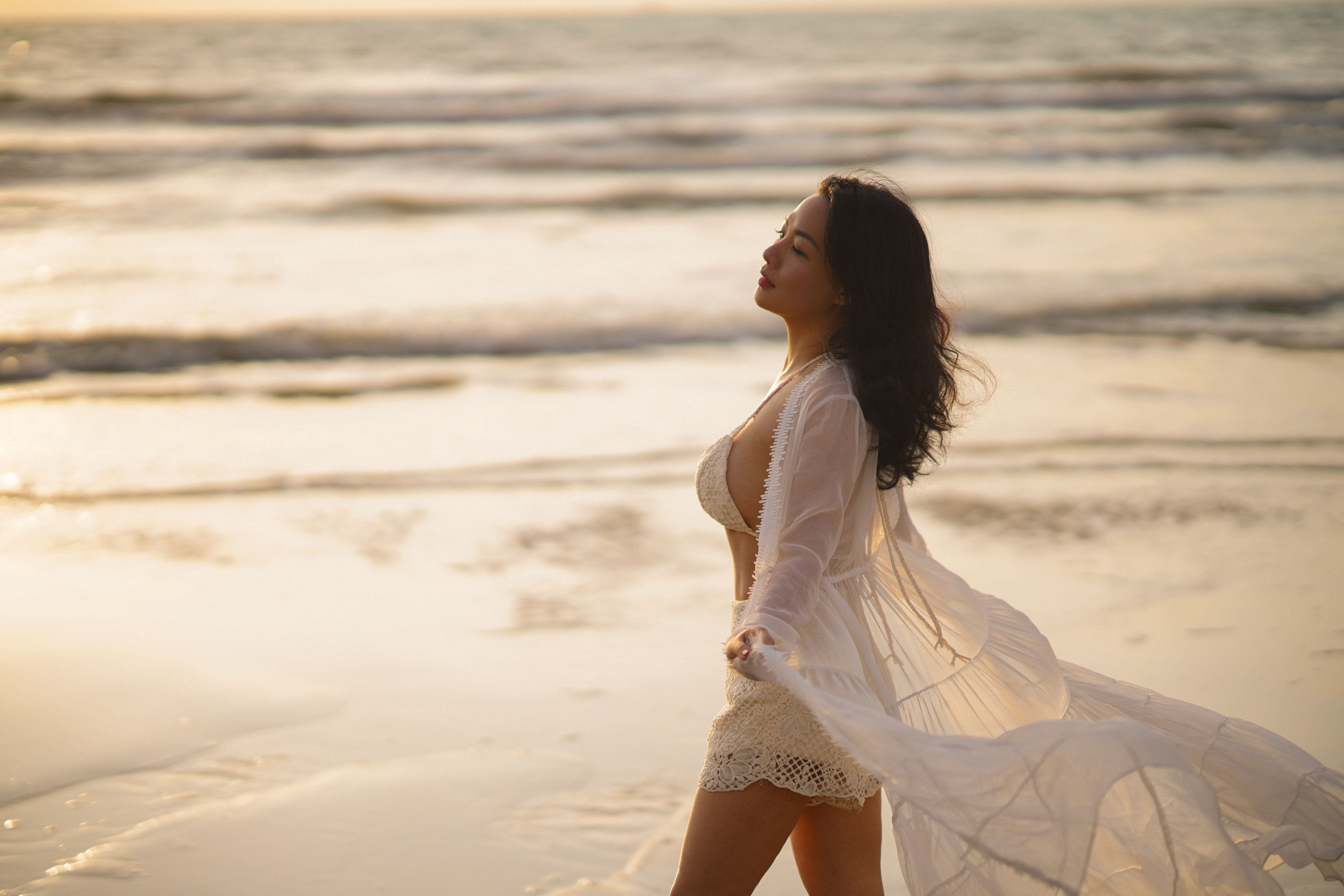 Woman in White Bikini with Cotton Mesh Summer Dress Standing on Shore   Free Stock Photo