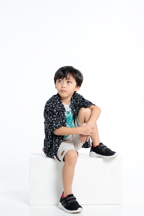 Child Model in Patterned Shirt