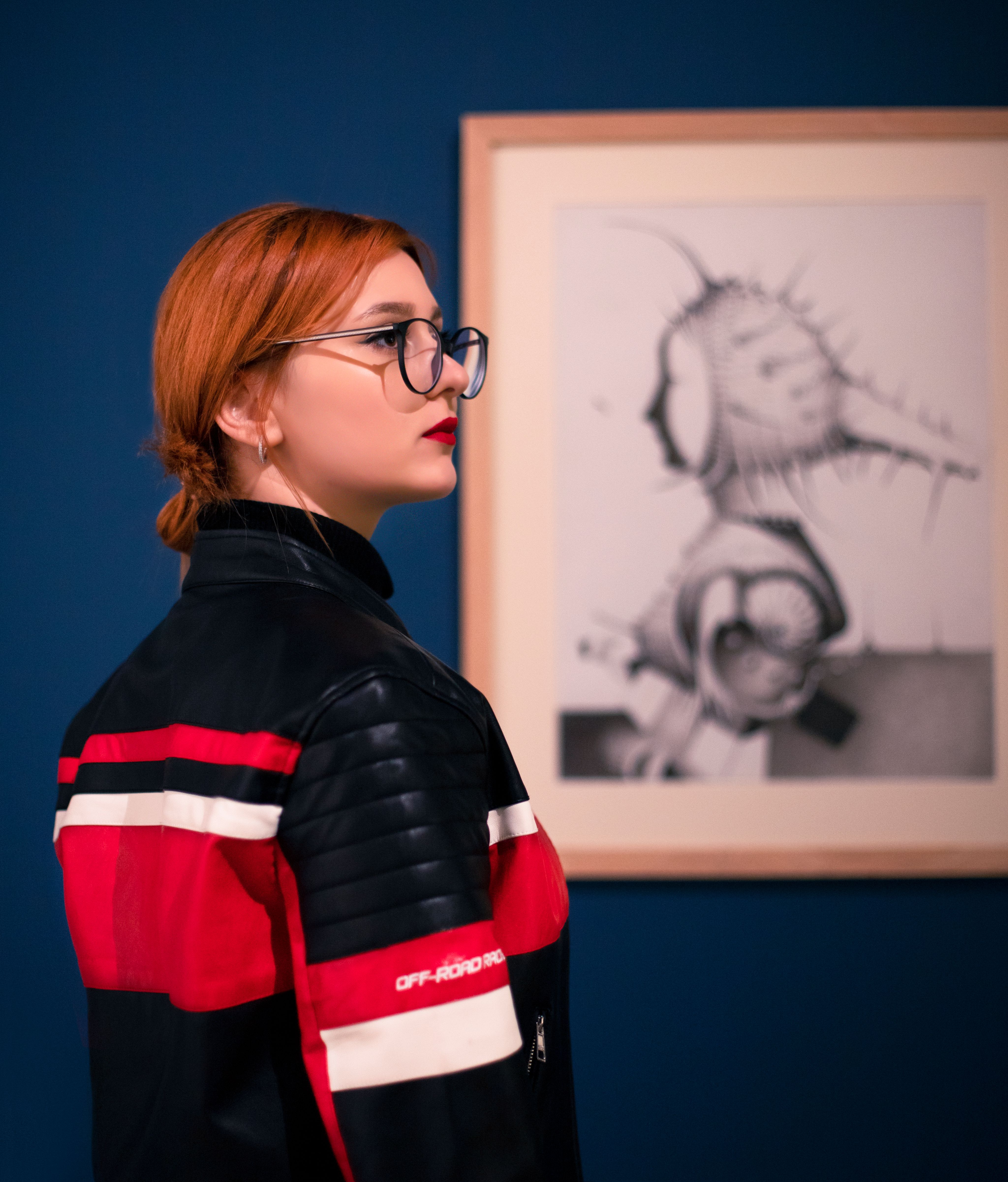 Stylish woman with glasses at an art exhibition in Baku, Azerbaijan.