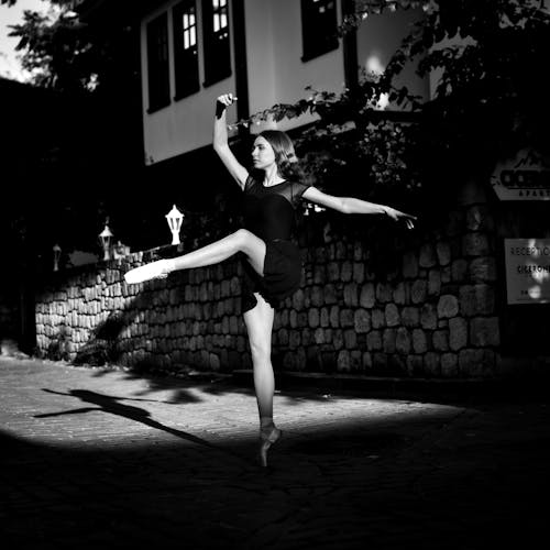 Grayscale Photo of Woman Dancing Ballet