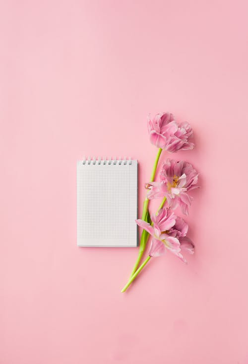 Notepad and Pink Flowers