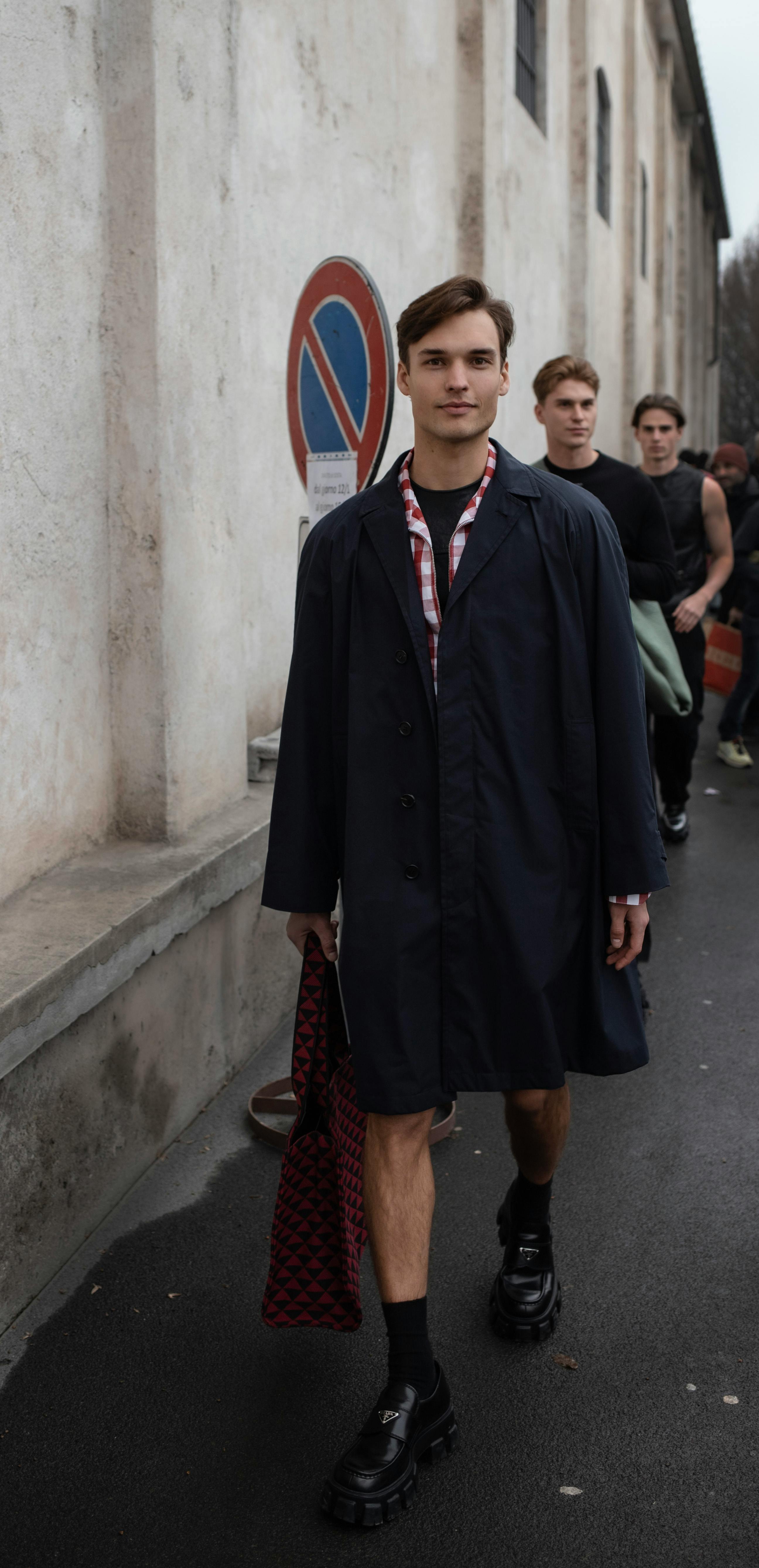 men standing in city street