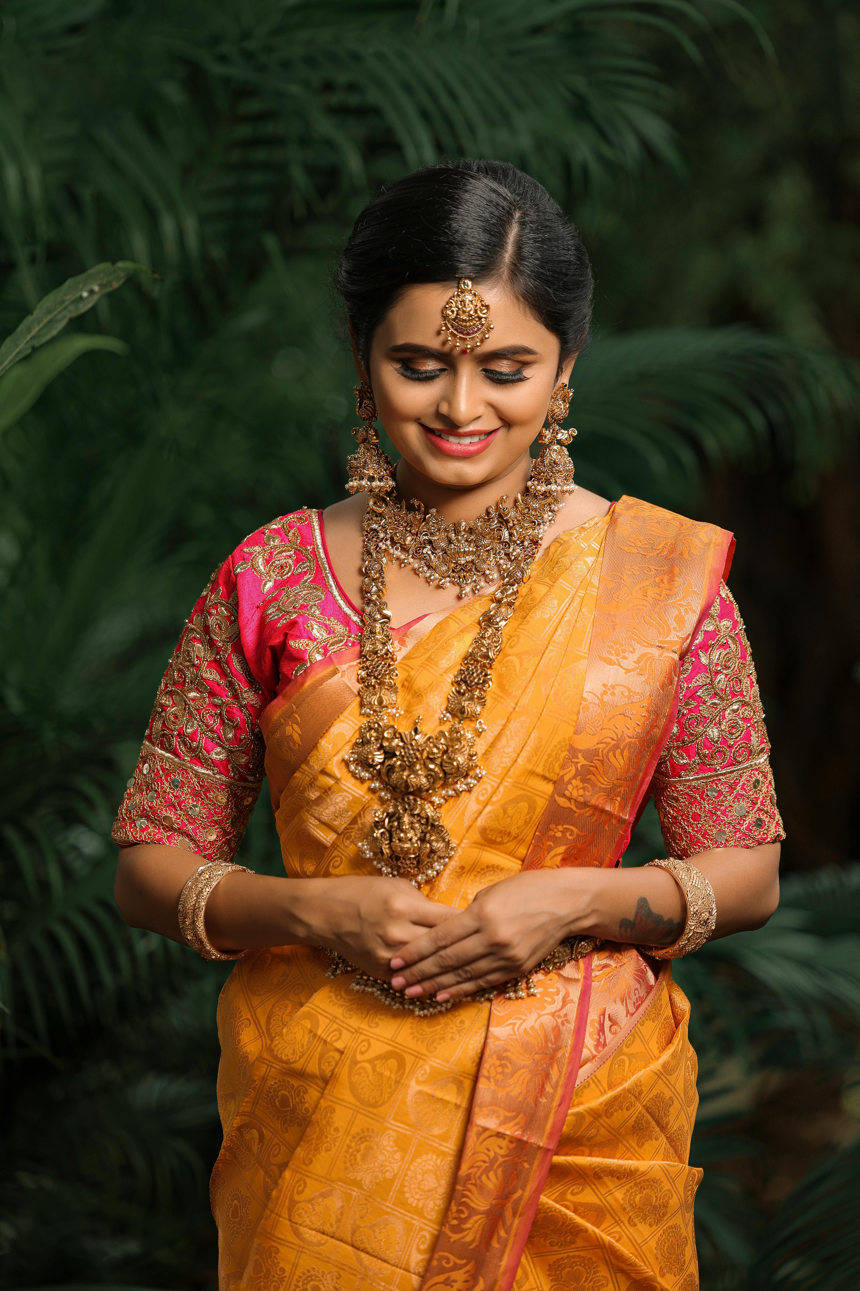 Woman in Traditional Bridal Saree Dress Free Stock Photo